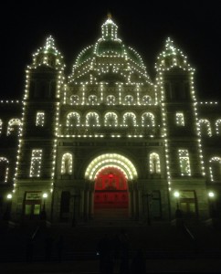 Red and yellow illuminate BC Legislature bldg in Victoria, BC on World Hepatitis Day 2015